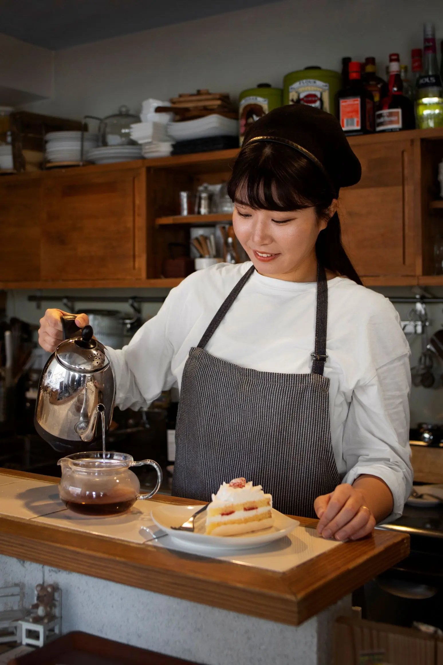 Young Woman Arranging Her Cake Shop
